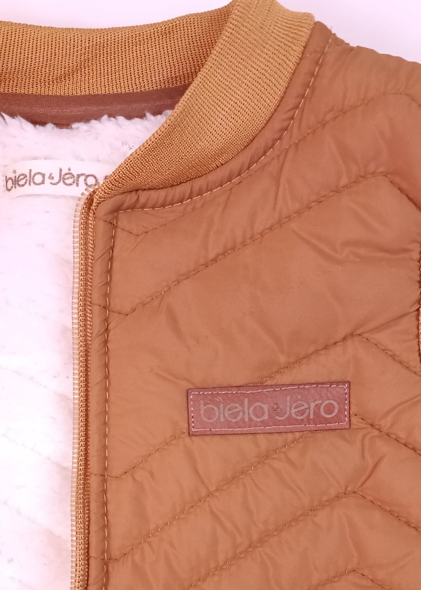 Chaleco impermeable con ovejero niño