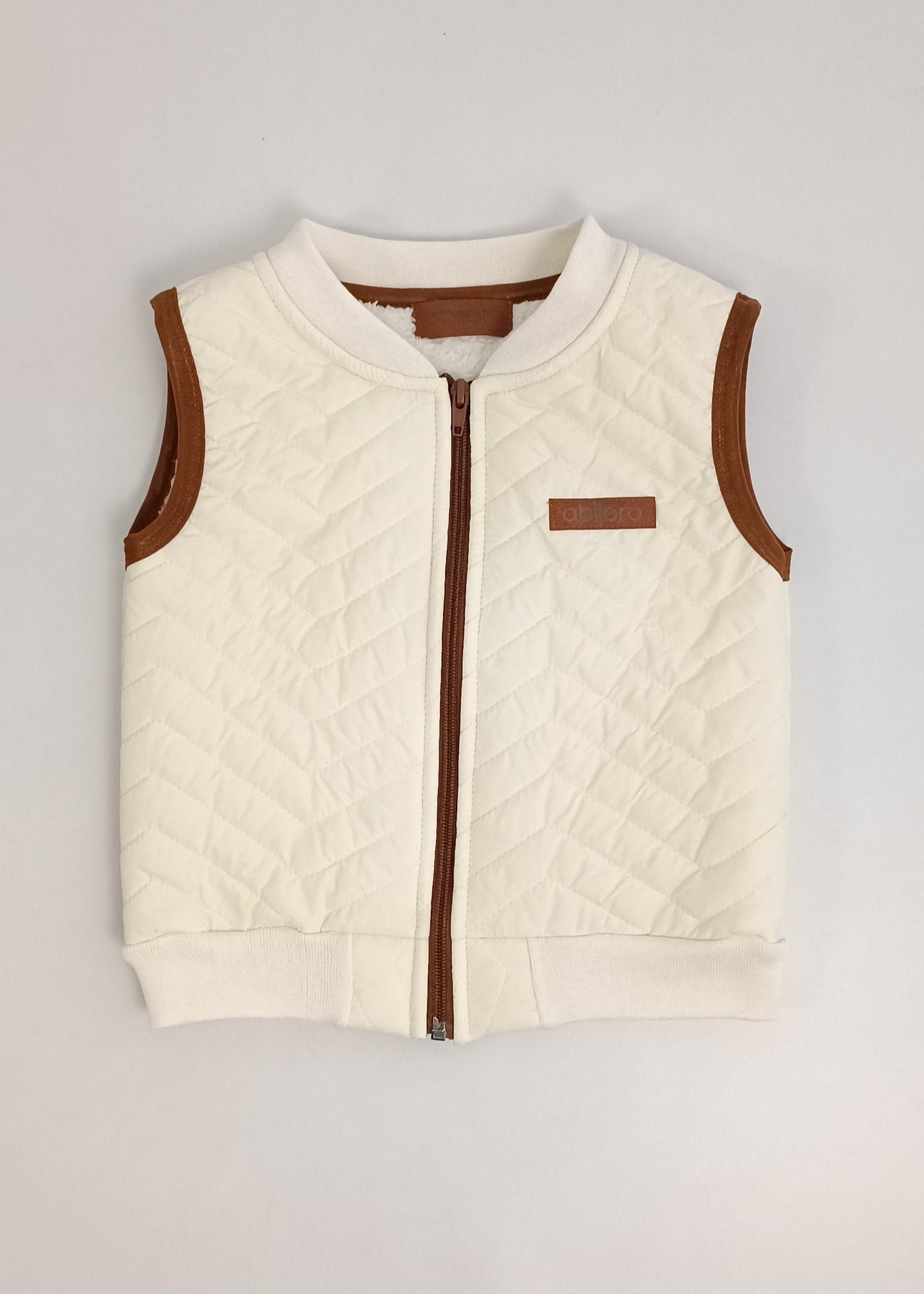 Chaleco impermeable con ovejero niño